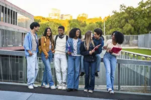 Young Adults Studying Prints: Group of young multicultural students standing together