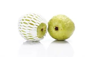 Plastic Packaging Prints: Two guavas, one packed in plastic