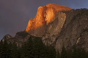 Setting Sun Atmosphere Prints: Half Dome illuminated by setting sun