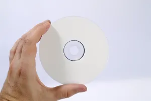Data Backup Prints: Hand holding a CD