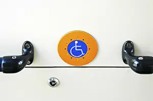 Wheelchair User Symbol Prints: The Handicaped Button in the tramway
