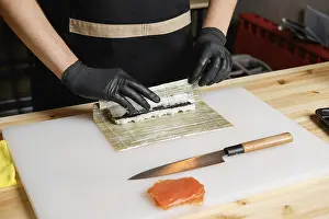 Healthy Meal Options Lunch Dinner Prints: Hands of chef making salmon rolls