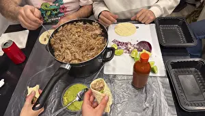 Traditional Mexican Cuisine Prints: Hands preparing and assembling carnitas tacos with pulled pork
