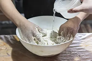 Meal Preparation Techniques Prints: Detail of hands preparing dough for baking bread