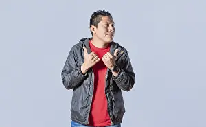 Latin American Ethnicity Model Prints: Handsome man pointing to the side