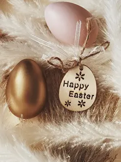 Easter Egg Symbolism Prints: Happy Easter. Golden easter egg on rustic background
