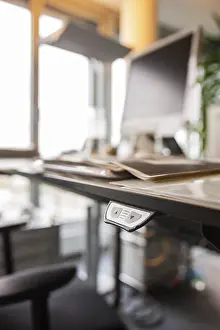Office Workstation Prints: Height-adjustable desk in an office