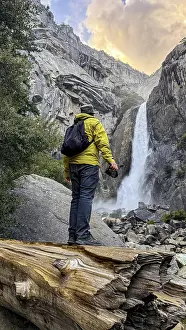 Yosemite National Park Landscape Prints: Hiker with backpack and camera standing on a fallen log