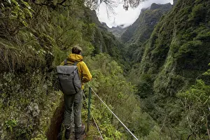 Hiking In Madeira Prints: Hikers on a narrow path along a levada