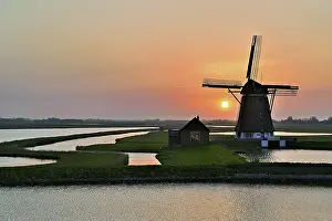 Historic Windmill Prints: Historic windmill in the light of the setting sun