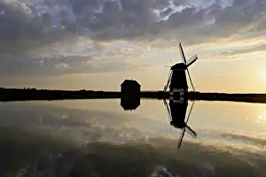 Historic Windmill Prints: Historic windmill in the light of the setting sun