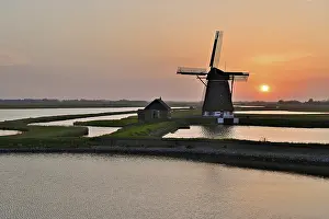 Sunset In The Netherlands Prints: Historic windmill in the light of the setting sun