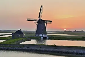 Historic Windmill Prints: Historic windmill in the light of the setting sun