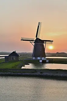 Historic Windmill Prints: Historic windmill in the light of the setting sun