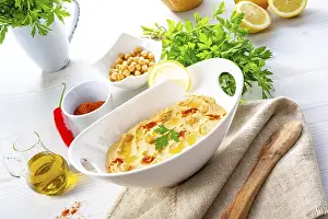 Hummus With Lemon And Chilli Prints: Hummus paste with lemon and chilli on a white background