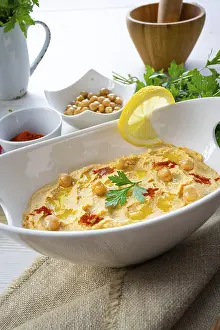 Arabic Cuisine Inspiration Prints: Hummus paste with lemon and chilli on a white background