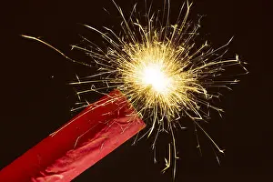 Deserted Fireworks Display Prints: Ignited firework, firecracker, firecracker with burning fuse