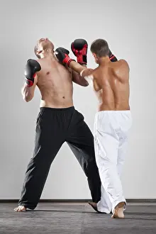 Boxing Match Prints: An image of two men box fighting