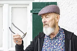 Healthcare Images Prints: An image of an old man and his glasses