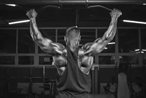 Weight Training Routine Prints: Image of a powerful athlete doing a pull-up in the gym