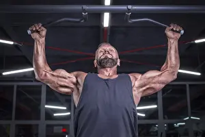 Healthy Lifestyle Tips Prints: Image of a powerful athlete doing a pull-up in the gym