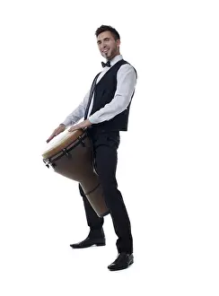 Studio Shot Musician Prints: Image of smiling young drummer posing at camera