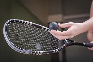 Tennis Equipment Prints: Image of a woman's hand with a squash racket
