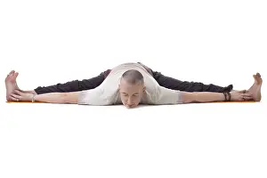 Male Yoga Model Prints: Image of yogi posing on split, isolated over white backdrop