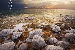 Uninhabited Beach Scene Prints: Improbable spring thunder-storm above the sea