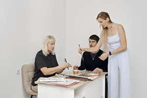 Communication Skills Prints: Three individuals engage in a creative workshop
