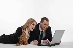 Couple Working Together Prints: Two individuals engaged in a collaborative activity