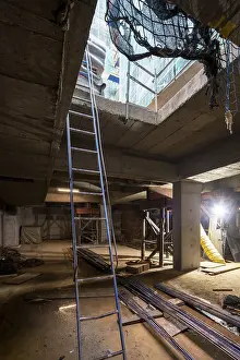 Construction Work Process Prints: An indoor construction site with essential elements like ladders