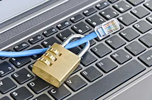 Secure Internet Connection Prints: Internet cable and padlock on computer keyboard symbolizing data security