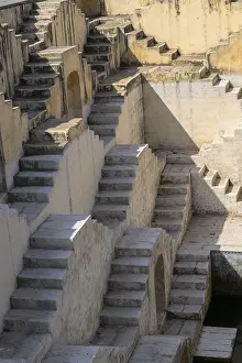 Ancient Indian Structures Prints: Intricately carved stone steps create geometric patterns in an ancient structure