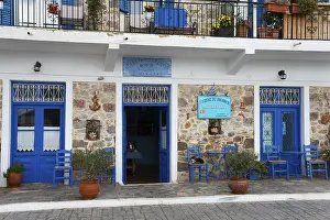 Peloponnese Travel Photography Prints: Inviting cafe with blue elements and stone wall