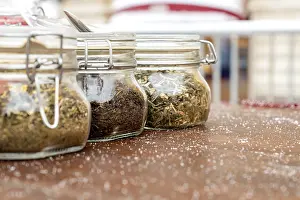 Alternative Medicine Tea Prints: Jars with three different types of tea are on the table
