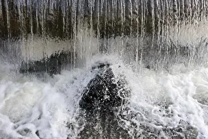 Crystal Clear Water Prints: The jets of water falling on rocks