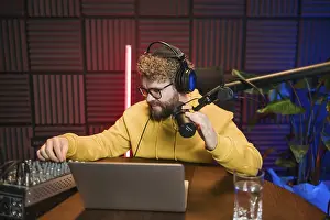 Images Dated 6th February 2024: Print of a Young Male Radio Host Reading News and Information