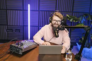 Images Dated 6th February 2024: Print of a Young Male Radio Host Reading from a Script