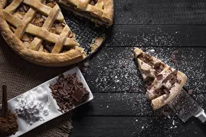 Sweet Dessert Ideas Prints: Kitchen table with a whole apple pie and one slice on a knife