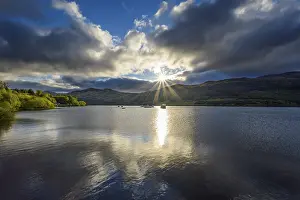 Scottish Nature Photography Prints: Lake with dramatic clouds and sun in spring