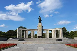 Soviet Memorial Berlin Prints: A large monument with a statue on a platform