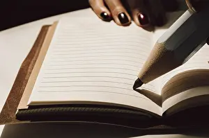 Time Management Tool Prints: Large pencil is standing on a sheet of a notebook