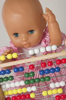 Educational Institution Image Prints: Learning arithmetics, doll using an abacus