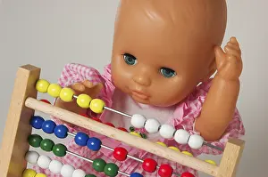 Educational Institution Concept Prints: Learning arithmetics, doll using an abacus