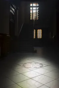 Dark Corridor Prints: Light falls through a window into a dark corridor