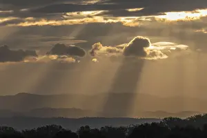 Morning Clouds Prints: Light rays of the sun's rays through clouds in the morning