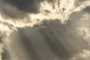 Cloudy Sky Europe Prints: Light rays of the sun's rays through clouds in the morning