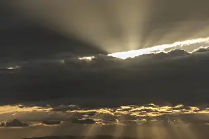 Contemplative Atmosphere Prints: Light rays of the sun's rays through clouds in the morning