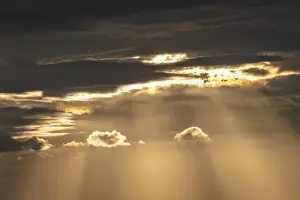 Serene Atmosphere Prints: Light rays of the sun's rays through clouds in the morning